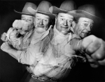 John Wayne poses for repetitive strobe photo showing what it looks like to be punched by the star, ca. 1940s